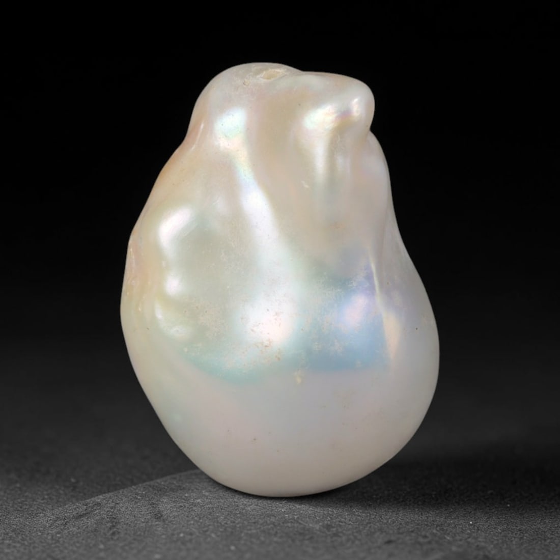Natural Freshwater Keshi Pearl - Iridescent Baroque Pearl Ornament, 60AE: A natural freshwater keshi pearl with organic asymmetrical baroque shaping, exhibiting soft creamy blush base tones with shifting pastel pink, lavender and pale gold iridescent luster across its smoot