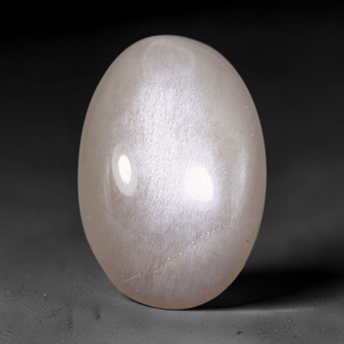 17.42 Carats Natural Ceylon Pale Taupe White Moonstone Cabochon Loose Gemstone, 90AB: This gentle pale taupe white moonstone displays a smooth silky body with soft diffused adularescent sheen across its surface, measured at 23.4x15.6x6.6mm, its muted neutral tone delivers quiet refined