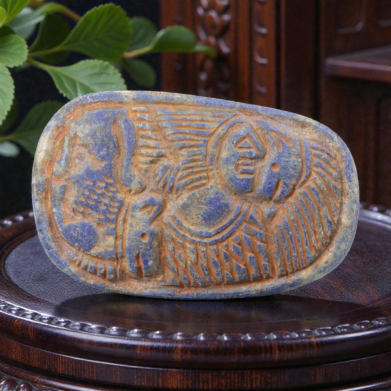 Near Eastern Lapis Lazuli Plaque - Tribal Figure & Animal Relief Carving, 95BF: Carved from rich lapis lazuli, this oval plaque features a 7x4.5cm (2.76x1.77in) relief composition centered on a stylized tribal figure, with incised linear details defining its form and geometric ac