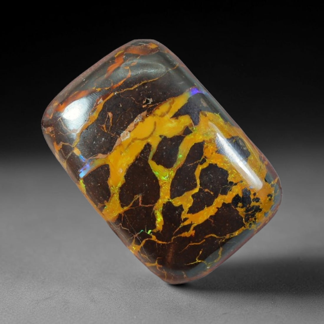 19.24ct Natural Australian Queensland Matrix Boulder Opal Cabochon, 69AT: Hand polished rectangular cushion cabochon crafted from unmodified Queensland matrix boulder opal, featuring dense dark ironstone host threaded with broad, luminous golden opal veins shot through with