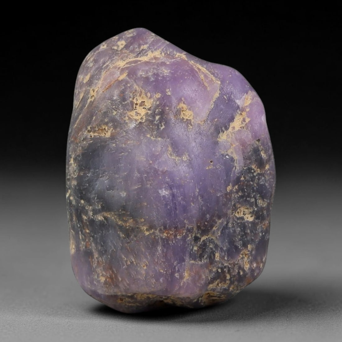 53.48ct Natural Unheated Sri Lankan Purplish Blue Sapphire Rough, 43FC: This natural corundum rough is an unheated purplish blue sapphire sourced from Sri Lankan alluvial gem deposits, featuring an irregular natural native form with residual pale yellow-brown mineral matr