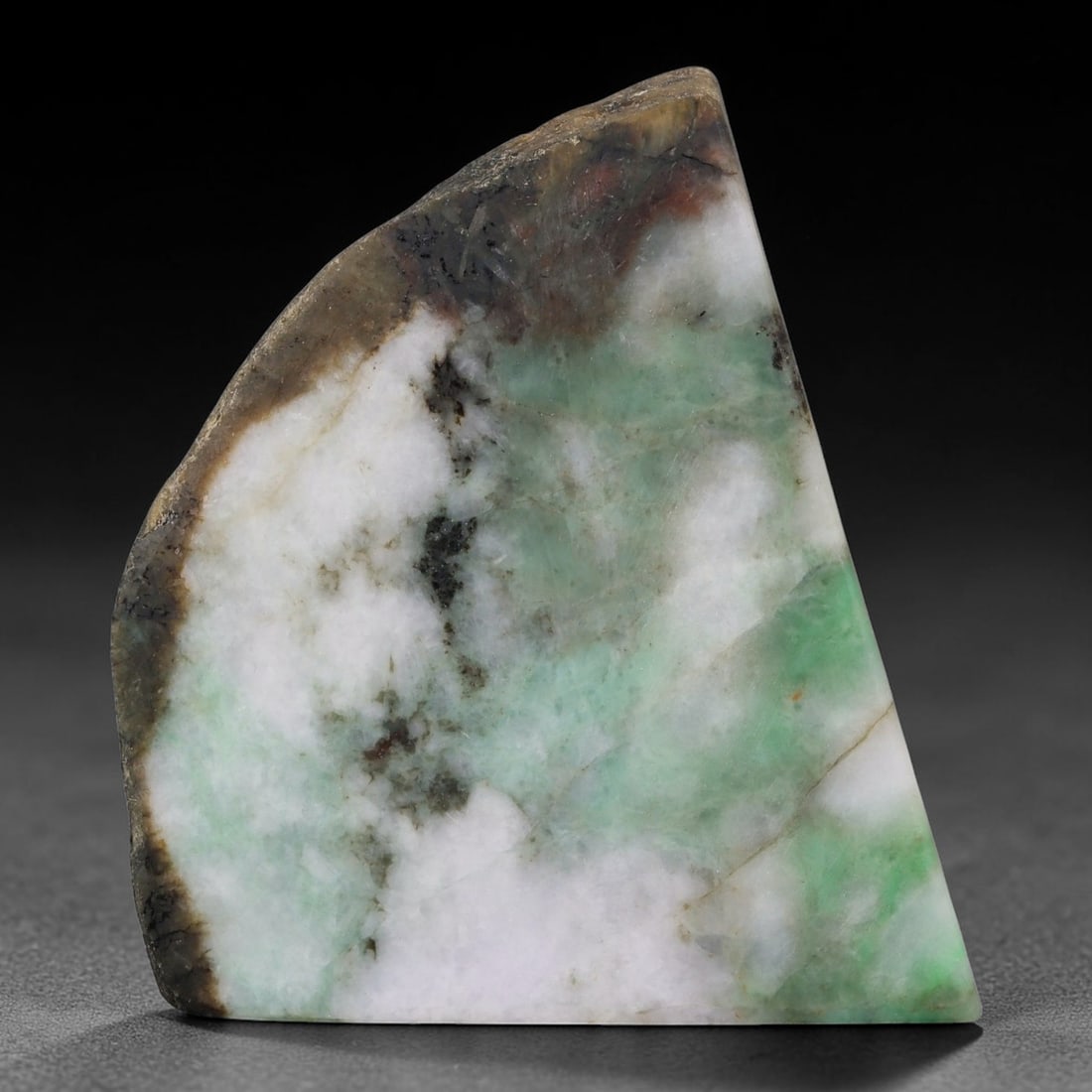 320ct Natural Type A Burmese Jadeite Jade Sliced Rough, 72FB: This specimen is a sliced rough block of natural Type A Burmese jadeite jade. The interior displays natural colour zoning with visible mineral veining and crystalline patterns typical of unprocessed j