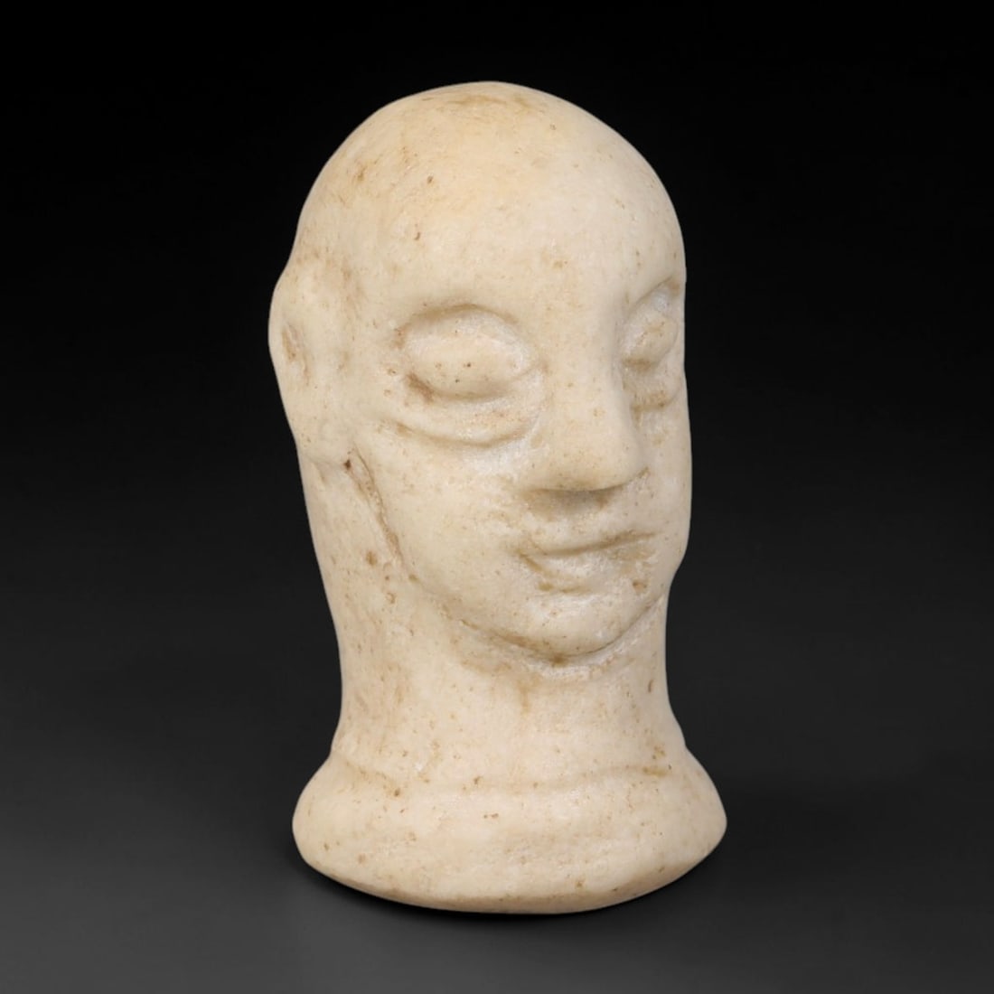 Ancient Bactrian Margiana Marble Idol Bust Amulet (2300-1700 BCE), 10AB: Miniature hand-carved pale marble bust idol from Bactrian-Margiana Archaeological Complex civilisation, crafted as a small devotional talisman figurine. Features the signature stylised bald human visa