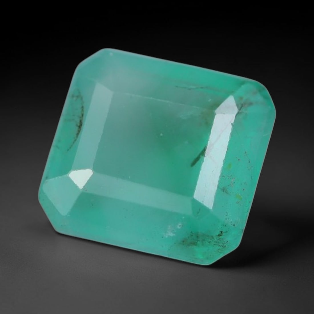 1.36 Carats Natural Zambian Green Emerald Loose Gemstone, 93AG: This green Zambian emerald holds smooth even saturation with subtle faint natural internal markings lending authentic organic character, measured at 6.8x6.4x3.6mm, its calm cool green tone delivers un