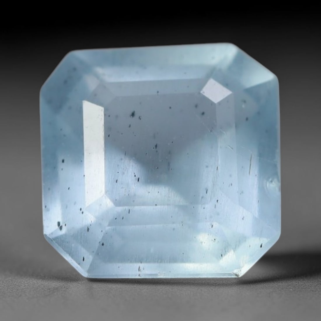1.61 Carats Natural Brazilian Soft Sky Blue Aquamarine Loose Gemstone, 41AG: This serene sky blue aquamarine carries smooth icy pale blue saturation with gentle light refracting across its polished facets, measured at 7.2x7.2x4.6mm, its cool tranquil tone lends effortless eleg