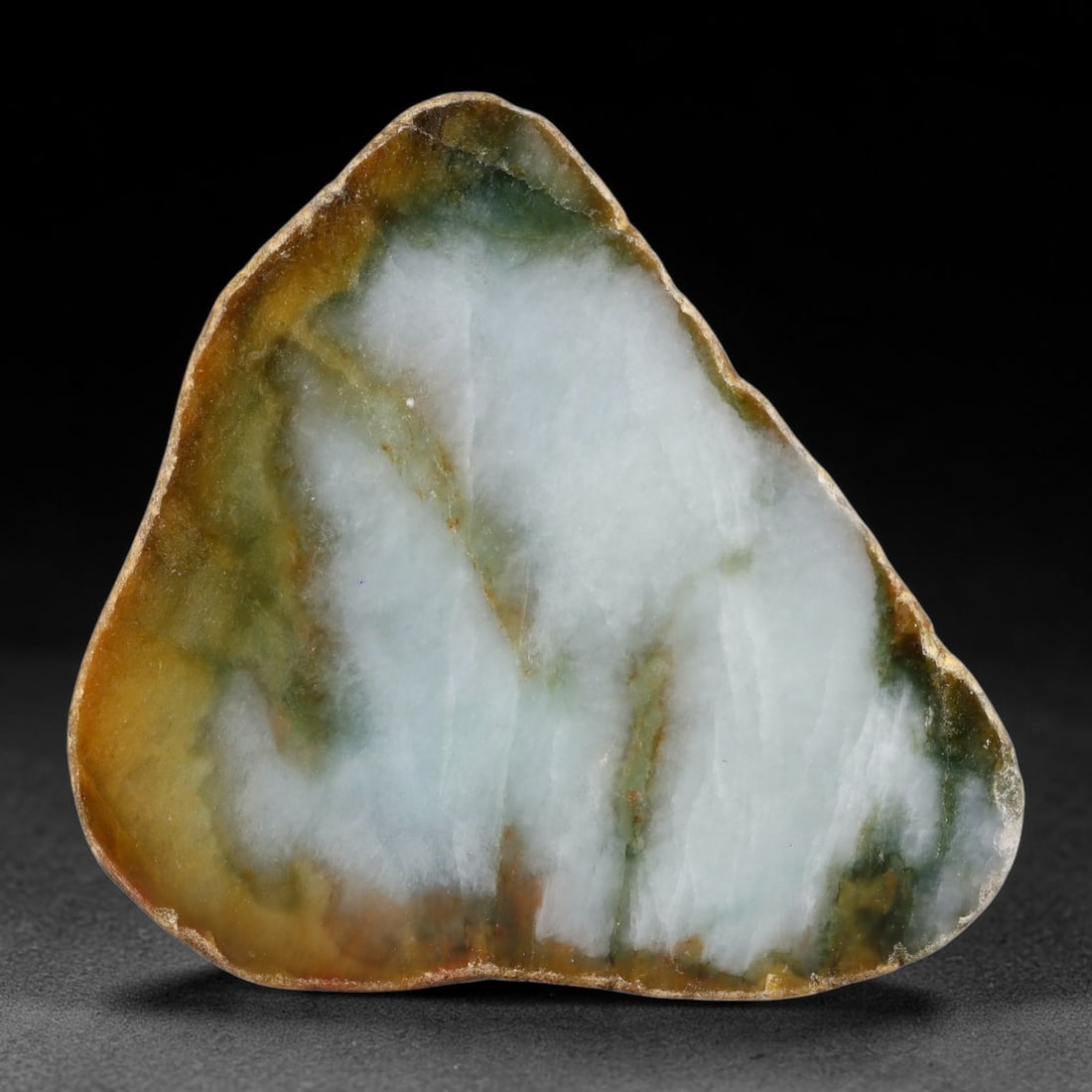 655ct Natural Type A Burmese Tri-Color Brown Green Cloud Jadeite Jade Sliced Rough, 4FA: This specimen is a natural sliced rough pebble of untreated Type A Burmese jadeite, retaining a full weathered reddish-brown outer skin on its reverse side, while its polished cut face features a defi