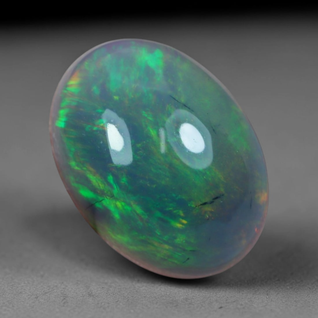 2.38 Carats Natural Ethiopian Welo Black Smoked Opal Cabochon Loose Gemstone, 49AG: This delicate black smoked opal from Ethiopian Welo showcases soft swirling bursts of blush pink, fiery red, mint green and faint lavender play of color floating across a milky translucent base, measu