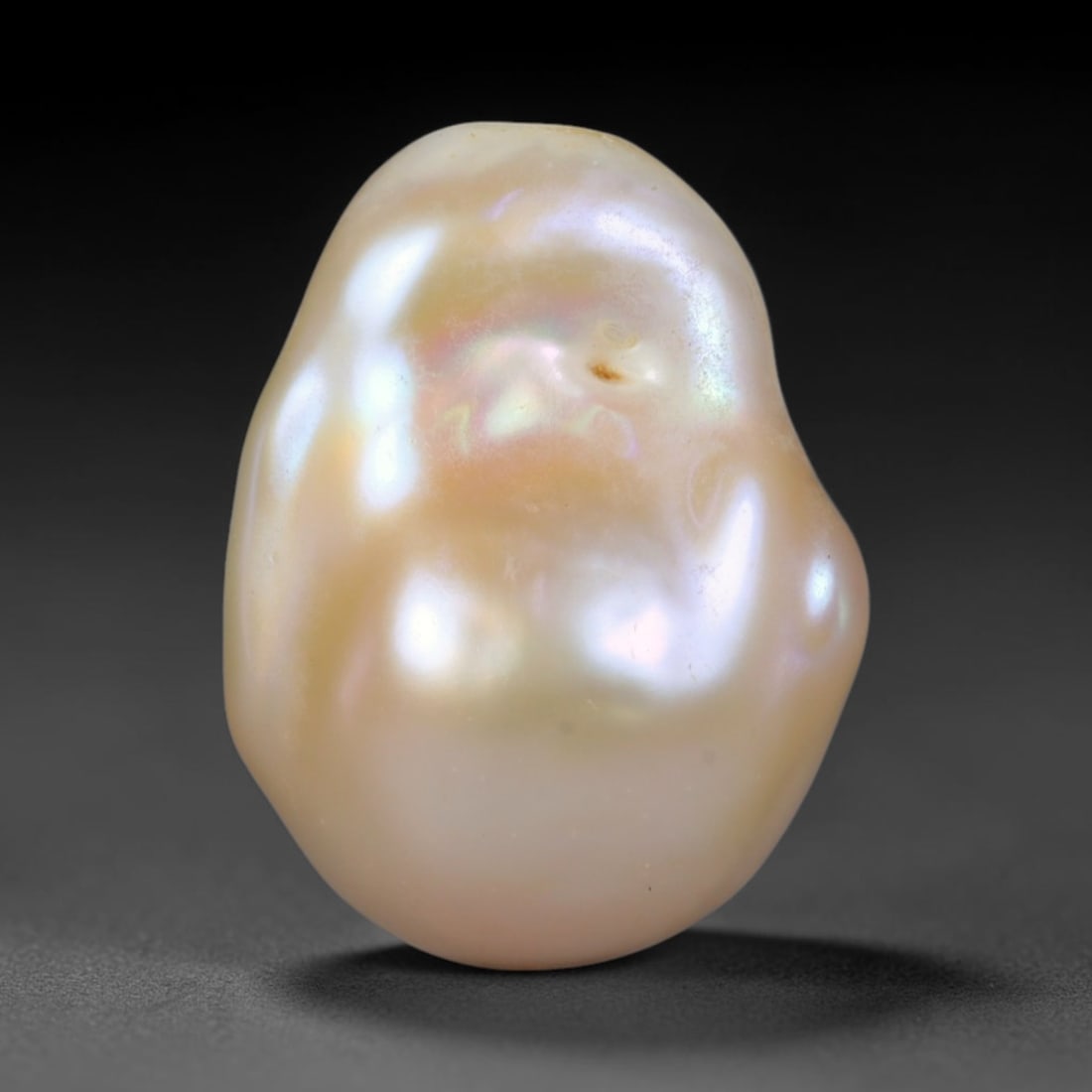 Natural Freshwater Keshi Pearl - Iridescent Baroque Pearl Ornament, 52AE: A natural freshwater keshi pearl with organic asymmetrical baroque shaping, exhibiting soft creamy blush base tones with shifting pastel pink, lavender and pale gold iridescent luster across its smoot