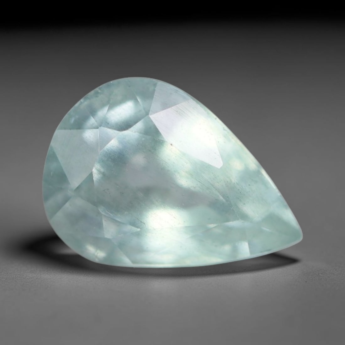 1.97 Carats Natural Brazilian Soft Sky Blue Aquamarine Loose Gemstone, 34AG: This serene sky blue aquamarine carries smooth icy pale blue saturation with gentle light refracting across its polished facets, measured at 9.8x7x5.5mm, its cool tranquil tone lends effortless elegan