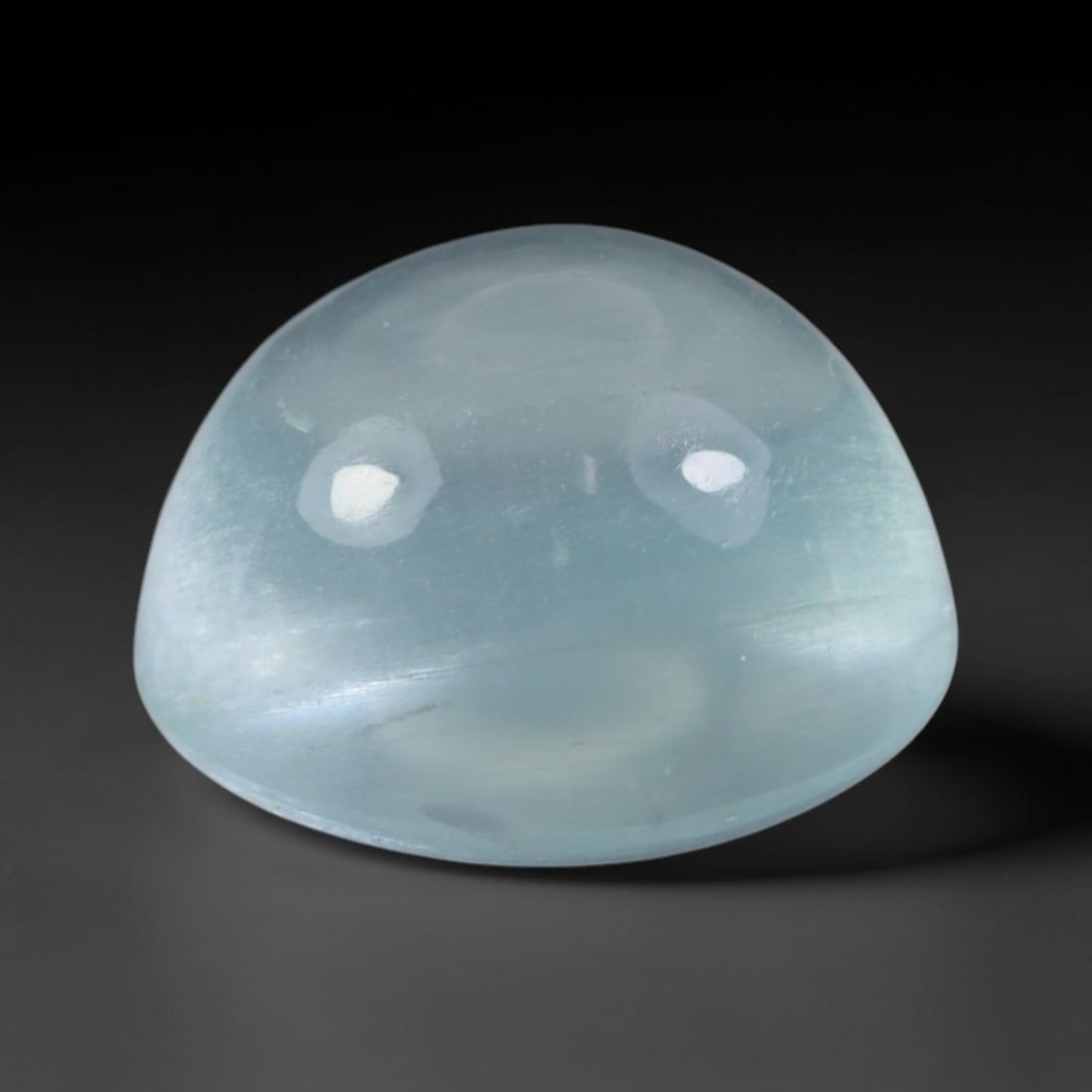 3.20 Carats Natural Brazilian Sky Blue Aquamarine Cabochon Loose Gemstone, 63AG: This silky smooth aquamarine cabochon carries a soft milky sky blue tone with delicate subtle shimmering fibrous inclusions that create gentle light reflection across its polished surface, measured at