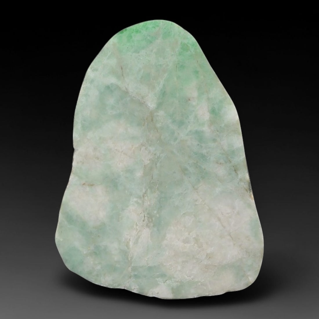 272ct Natural Type A Burmese Jadeite Jade Sliced Rough, 61AZ: This specimen is a sliced rough block of natural Type A Burmese jadeite jade. The interior displays natural colour zoning with visible mineral veining and crystalline patterns typical of unprocessed j