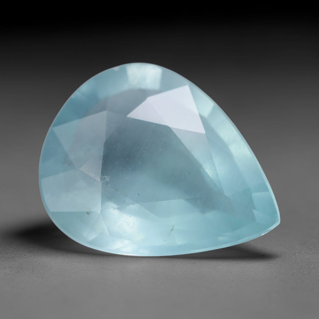 4.26 Carats Natural Brazilian Soft Sky Blue Aquamarine Loose Gemstone, 44AG: This serene sky blue aquamarine carries smooth icy pale blue saturation with gentle light refracting across its polished facets, measured at 14x11x5.2mm, its cool tranquil tone lends effortless elegan