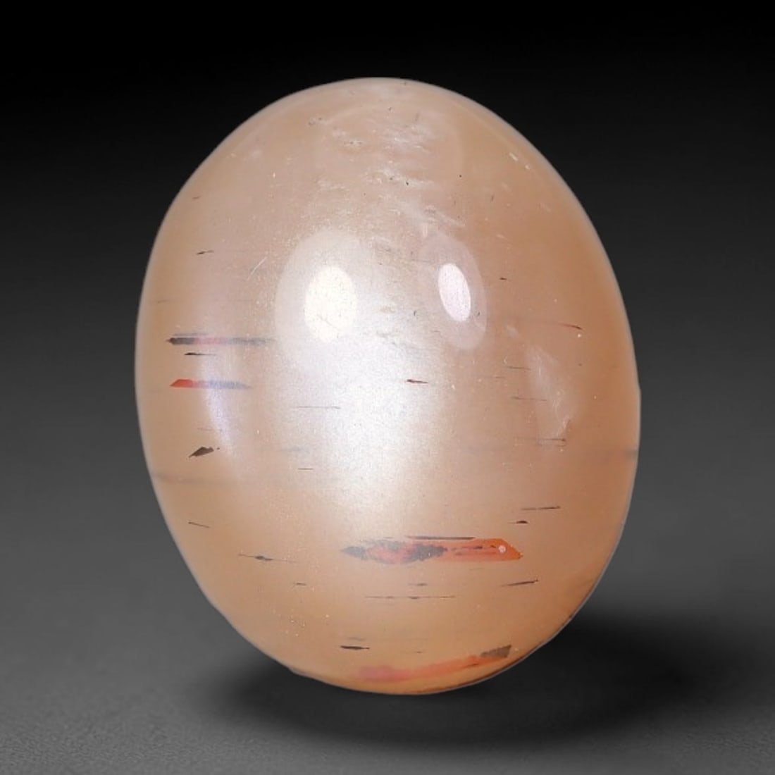 5.06 Carats Natural Ceylon Soft Peach Pink Moonstone Cabochon Loose Gemstone, 20AG: This warm soft peach pink moonstone features delicate sparkling mineral flecks scattered throughout its smooth surface paired with faint flowing adularescent glow, measured at 12.3x10.2x5.4mm, its gen