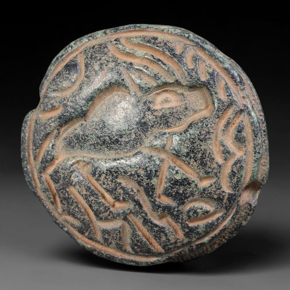 Ancient Western Asiatic Double Convex Schist Dual Sided Equine Intaglio Seal (1000-600 BCE), 75AB: Bi-convex polished dark schist double-sided pendant seal, horizontally perforated for suspension cord. Each convex face features distinct incised recumbent equine motifs enclosed within raised circula