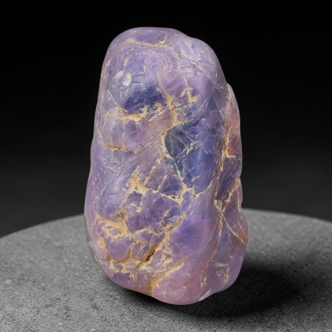 71ct Natural Unheated Sri Lankan Purplish Blue Sapphire Rough, 40FC: This natural corundum rough is an unheated purplish blue sapphire sourced from Sri Lankan alluvial gem deposits, featuring an irregular natural native form with residual pale yellow-brown mineral matr