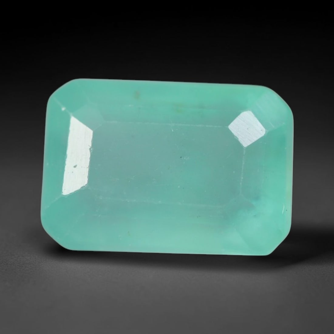 1.94 Carats Natural Zambian Green Emerald Loose Gemstone, 87AG: This green Zambian emerald holds smooth even saturation with subtle faint natural internal markings lending authentic organic character, measured at 8.2x5.7x4.8mm, its calm cool green tone delivers un