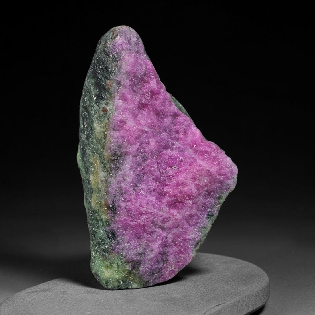 72ct Natural Tanzanian Ruby Zoisite Raw Rough Specimen Mineral Stone, 2FC: This unpolished mineral rough is natural ruby zoisite sourced from Tanzania, exhibiting distinct banded mineral segregation of vibrant green zoisite, magenta ruby crystals, and dark hornblende inclusi