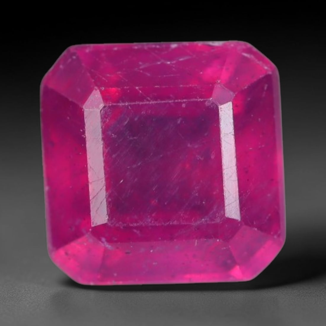 1.65 Carats Natural Madagascar Vivid Fuchsia Red Heated Ruby Loose Gemstone, 75AG: This vivid fuchsia red Madagascar ruby displays rich saturated red tone with subtle natural internal mineral traces that showcase genuine earth-grown character, measured at 6x4.1mm, the intense warm c