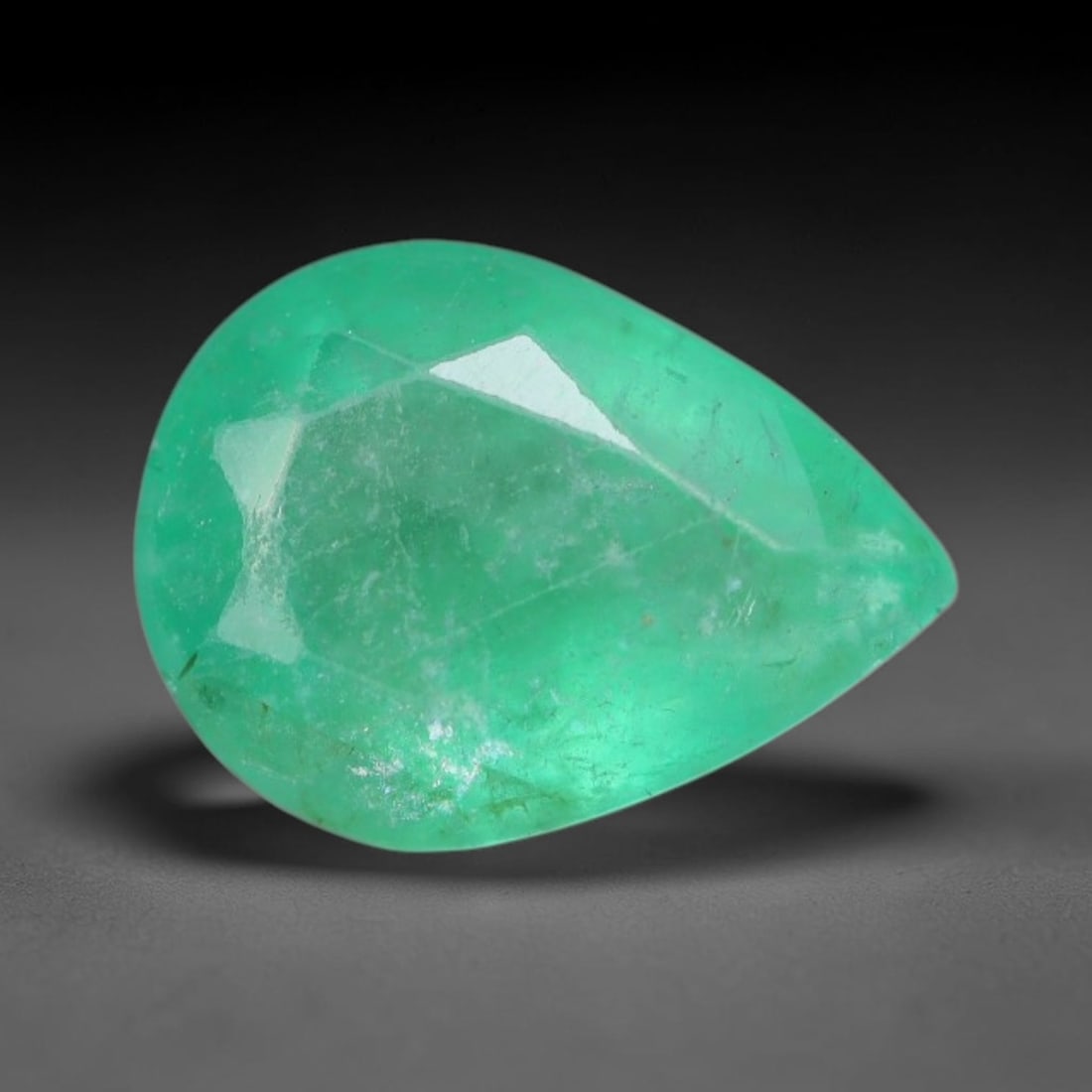 1.34 Carats Natural Zambian Green Emerald Loose Gemstone, 95AG: This green Zambian emerald holds smooth even saturation with subtle faint natural internal markings lending authentic organic character, measured at 8.6x6.3x4.1mm, its calm cool green tone delivers un