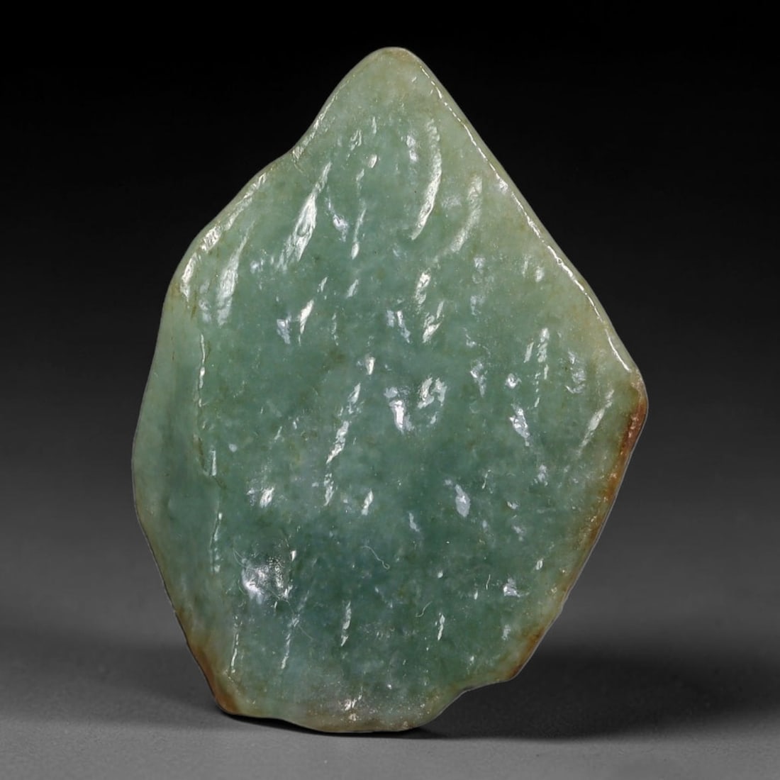 113ct Natural Type A Burmese Jadeite Jade Polished Sliced Rough, 86AZ: This specimen is a sliced rough block of natural Type A Burmese jadeite jade. The interior displays natural colour zoning with visible mineral veining and crystalline patterns typical of unprocessed j