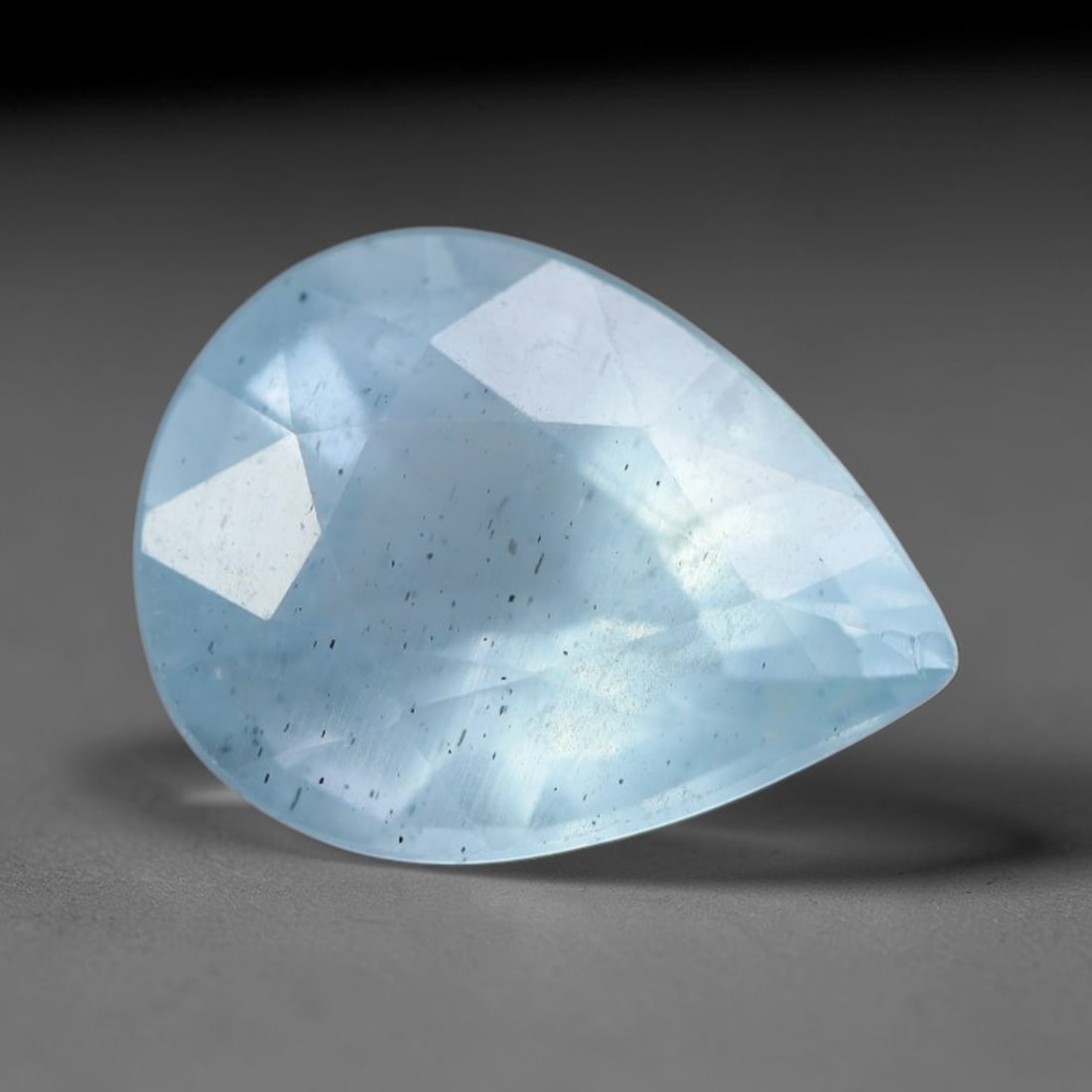 2.23 Carats Natural Brazilian Soft Sky Blue Aquamarine Loose Gemstone, 38AG: This serene sky blue aquamarine carries smooth icy pale blue saturation with gentle light refracting across its polished facets, measured at 10.5x8.1x5.2mm, its cool tranquil tone lends effortless ele
