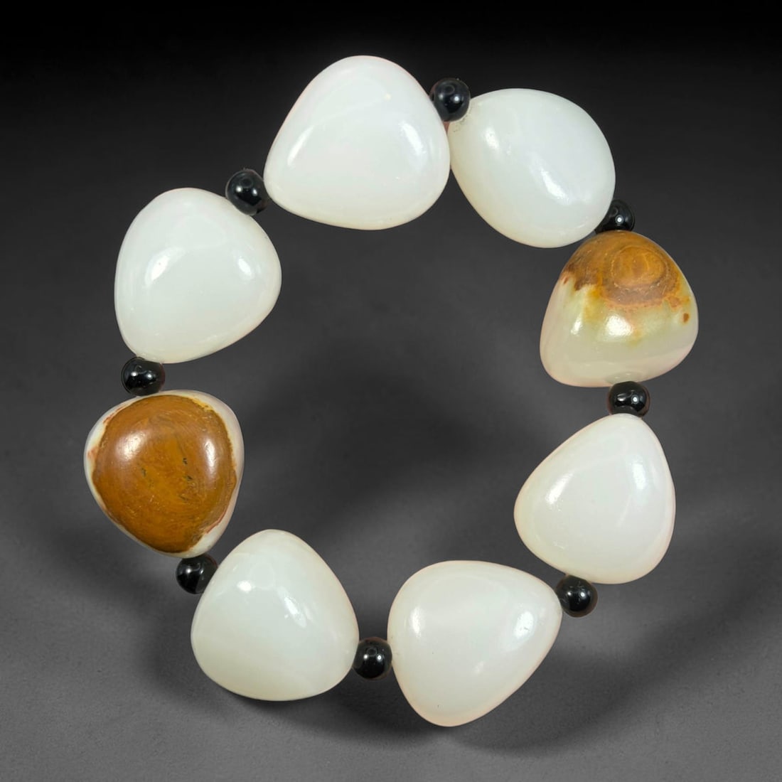 Chinese Natural White Nephrite Jade Bracelet with Raw Brown Skin Beads, Pebble Jade Beads, 14AS: Hand-strung single strand bracelet crafted from natural white nephrite jade pebble beads, each measuring 2.5cm in irregular teardrop shape. Most beads feature smooth milky white polished jade surfaces