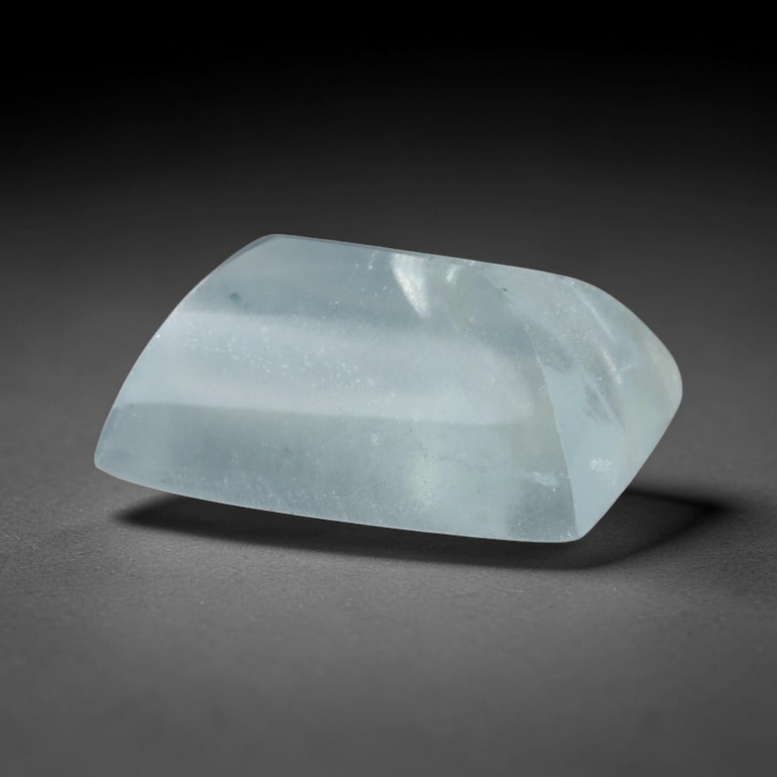 1.75 Carats Natural Brazilian Sky Blue Sugarloaf Aquamarine Loose Gemstone, 66AG: This smooth sugarloaf aquamarine features soft milky sky blue coloring with fine natural fibrous internal inclusions that lend gentle diffused luster across its polished surface, measured at 8.7x6.2x3