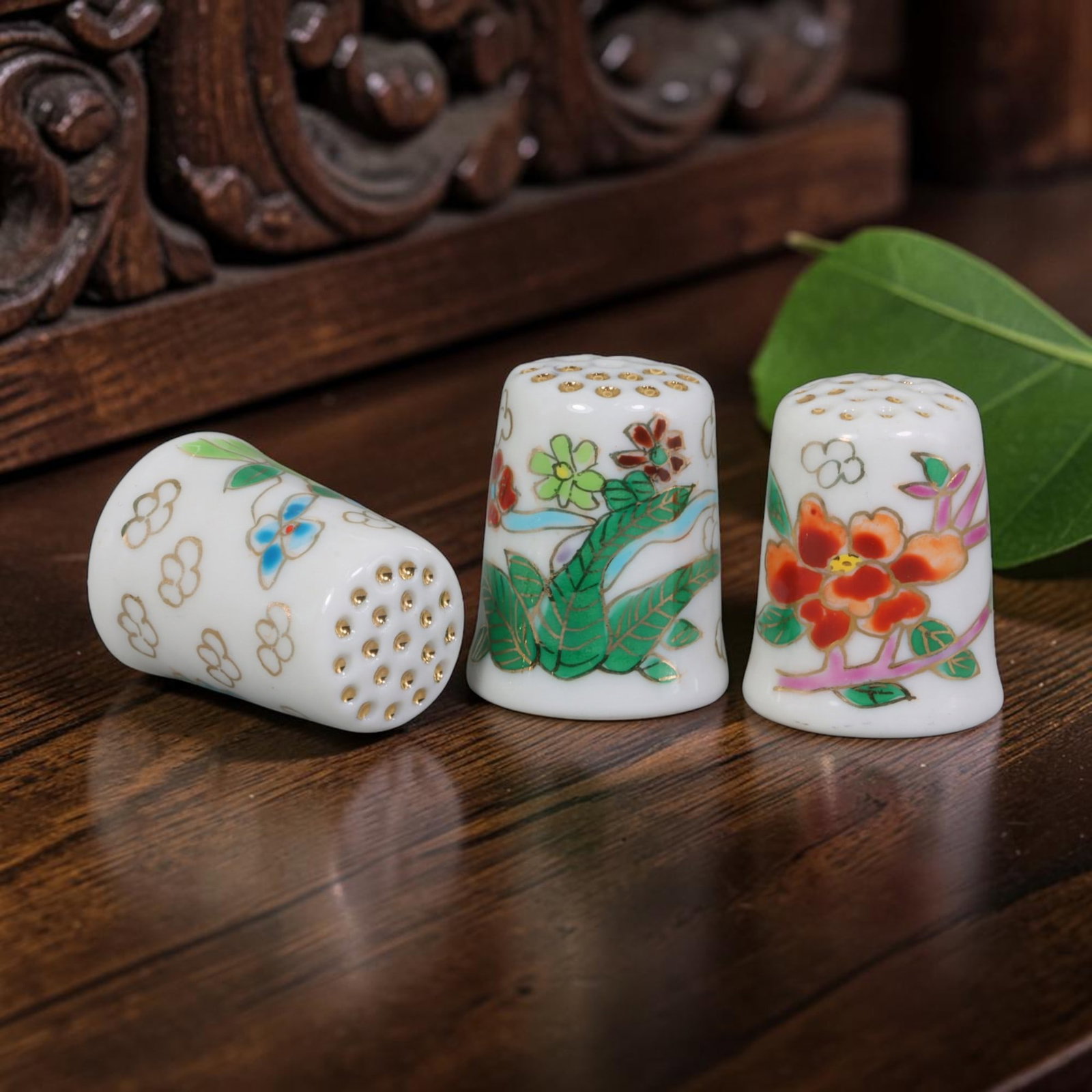 Vintage Hand-Painted Porcelain Floral Thimble Set of 3 - Mini Sewing Collectibles, 16AR: This curated collection includes three polished white porcelain sewing thimbles, each measuring 2.5 cm tall and fitted with traditional gold perforated dimpled crown tops for needlework protection. Th