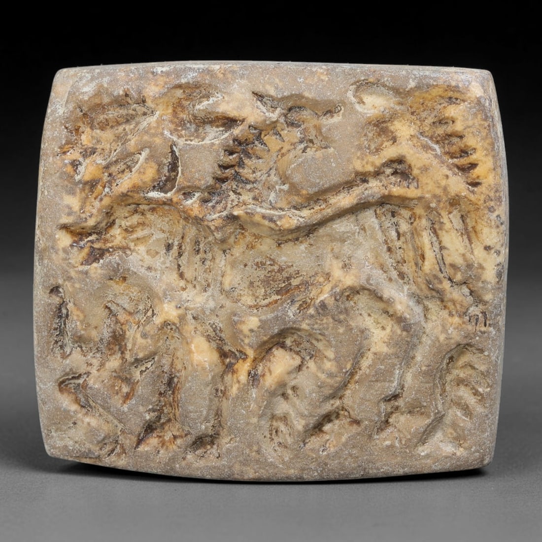 Ancient Sumerian Civilization Stone Figural Stamp Seal (4500-2000 BCE), 82AB: This pale weathered stone stamp originates from Sumerian Civilization, elite administrative and funerary seal artifacts carved to mark property and ritual offerings. One face bears deep relief animal 