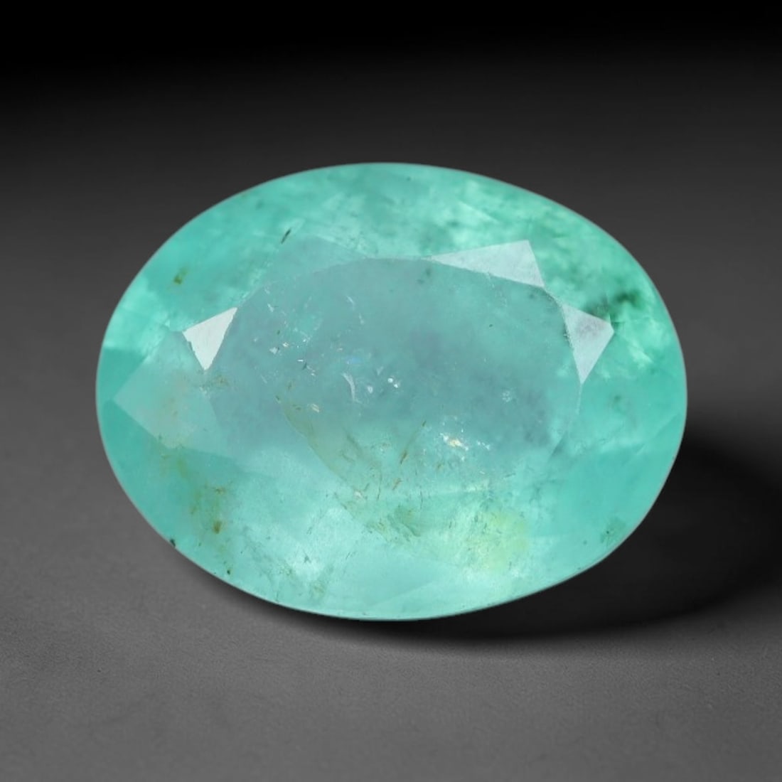 1.40 Carats Natural Zambian Green Emerald Loose Gemstone, 85AG: This green Zambian emerald holds smooth even saturation with subtle faint natural internal markings lending authentic organic character, measured at 8.3x6.4x4.1mm, its calm cool green tone delivers un