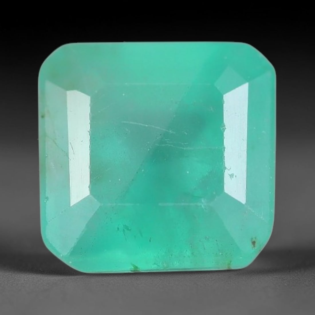 1.60 Carats Natural Zambian Green Emerald Loose Gemstone, 35AH: This green Zambian emerald holds smooth even saturation with subtle faint natural internal markings lending authentic organic character, measured at 6.6x5mm, its calm cool green tone delivers understa