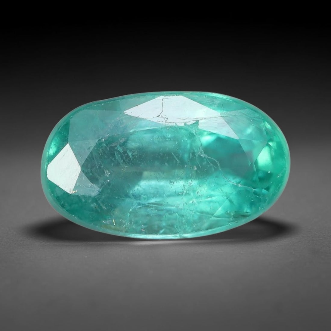 1.68 Carats Natural Zambian Green Emerald Loose Gemstone, 51AH: This green Zambian emerald holds smooth even saturation with subtle faint natural internal markings lending authentic organic character, measured at 10x5.8x4.2mm, its calm cool green tone delivers und