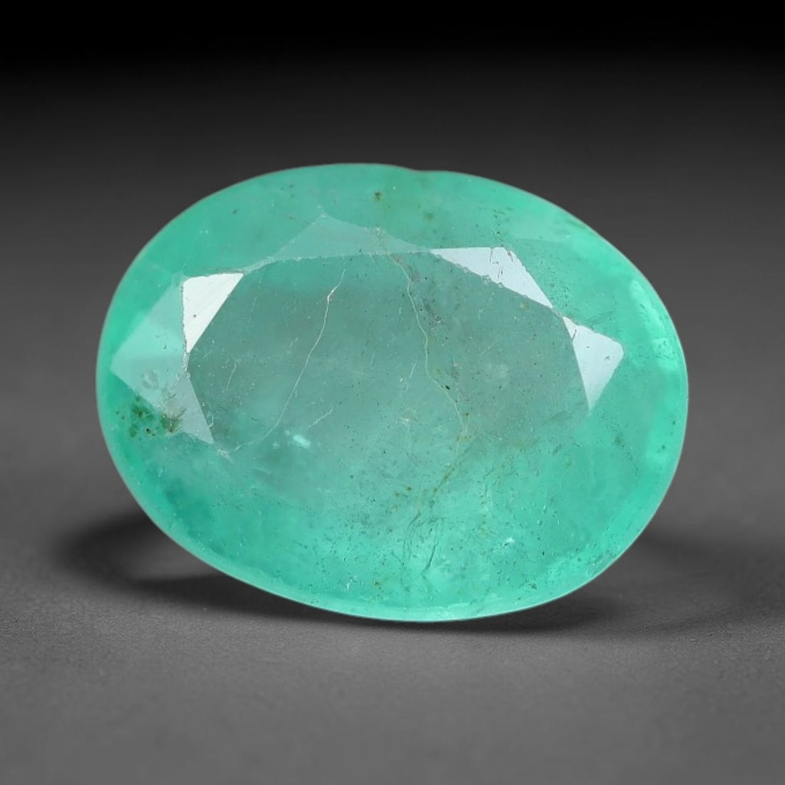 2.02 Carats Natural Zambian Green Emerald Loose Gemstone, 42AH: This green Zambian emerald holds smooth even saturation with subtle faint natural internal markings lending authentic organic character, measured at 9.4x7.3x4.5mm, its calm cool green tone delivers un