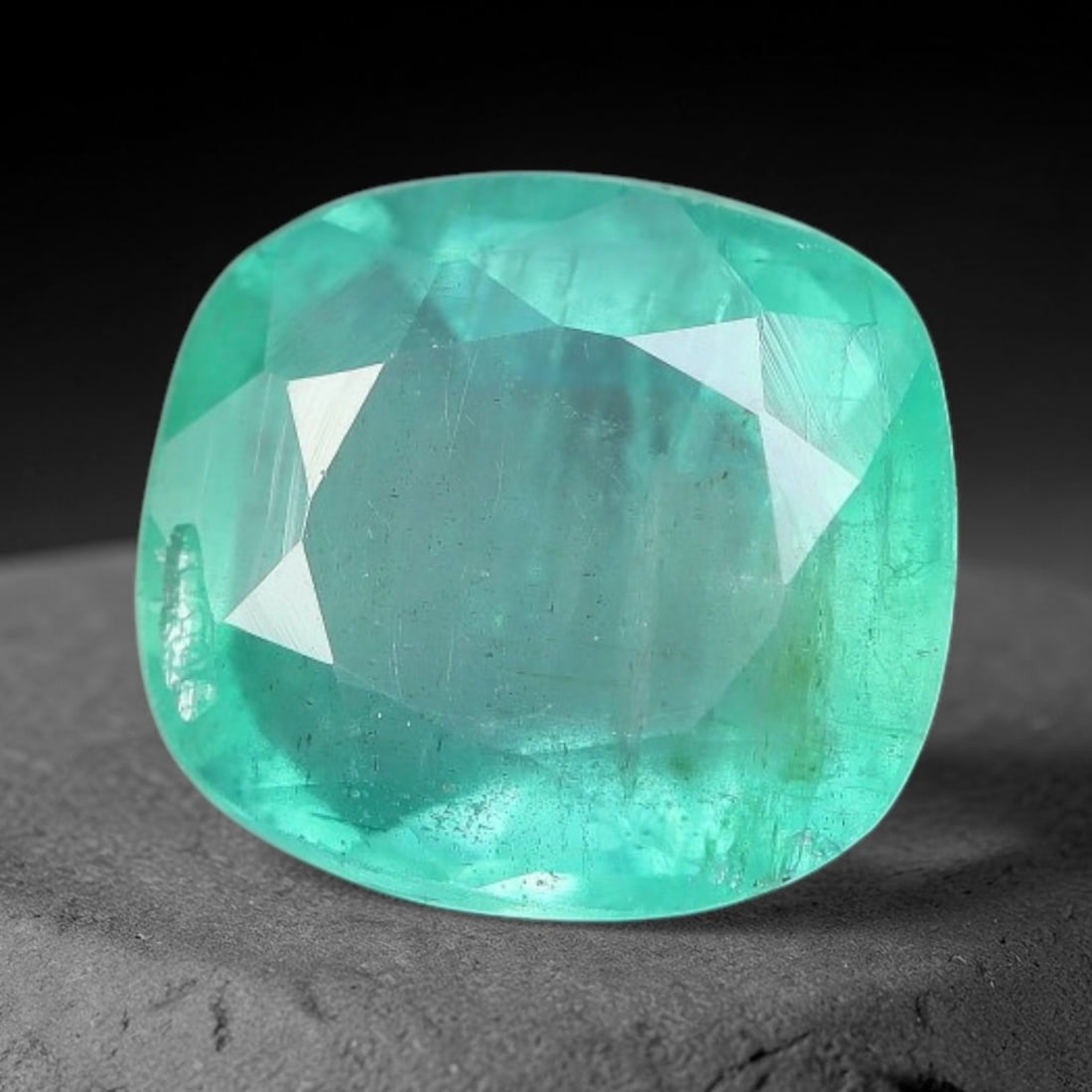 1.24 Carats Natural Zambian Green Emerald Loose Gemstone, 39AH: This green Zambian emerald holds smooth even saturation with subtle faint natural internal markings lending authentic organic character, measured at 7.2x6.6x3.7mm, its calm cool green tone delivers un
