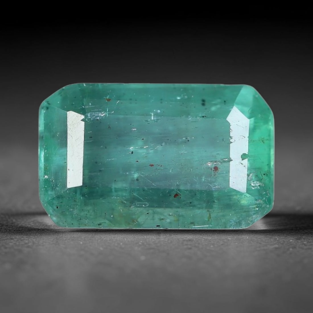 1.63 Carats Natural Zambian Green Emerald Loose Gemstone, 34AH: This green Zambian emerald holds smooth even saturation with subtle faint natural internal markings lending authentic organic character, measured at 8.9x5.5x4.3mm, its calm cool green tone delivers un