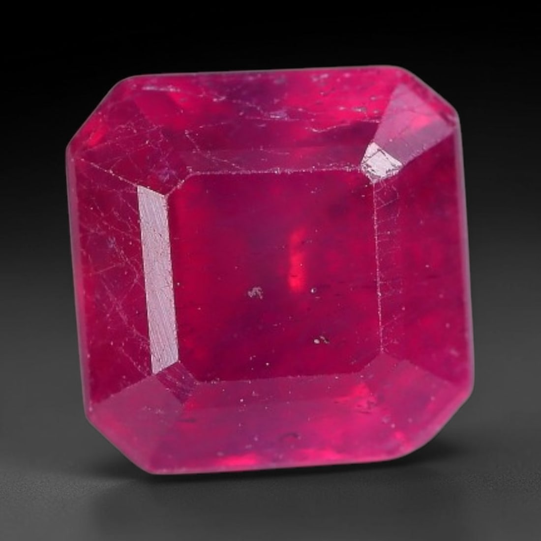 1.64 Carats Natural Madagascar Vivid Fuchsia Red Heated Ruby Loose Gemstone, 6AH: This vivid fuchsia red Madagascar ruby displays rich saturated red tone with subtle natural internal mineral traces that showcase genuine earth-grown character, measured at 6x4.4mm, the intense warm c