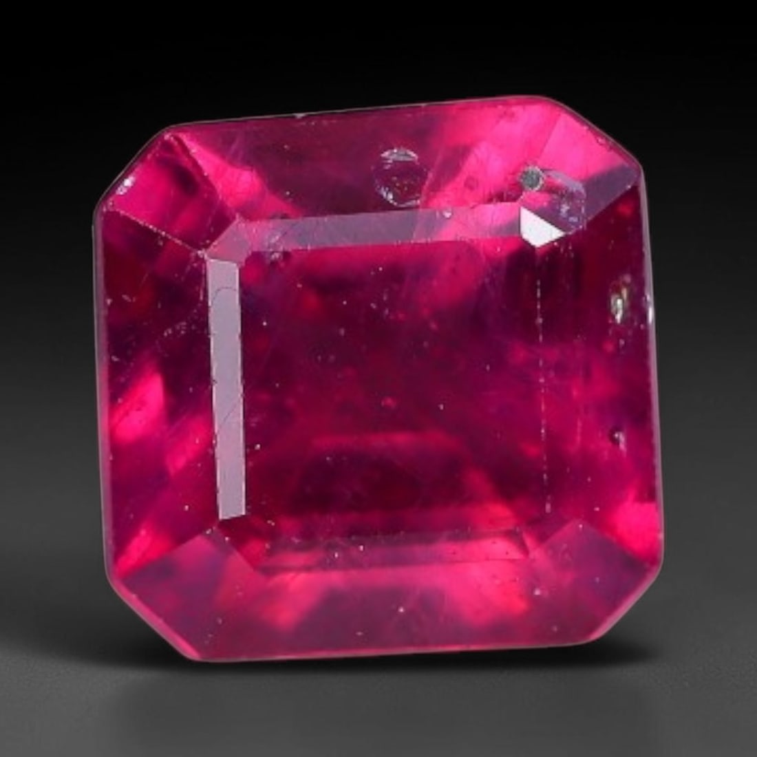 0.84 Carats Natural Madagascar Vivid Fuchsia Red Heated Ruby Loose Gemstone, 12AH: This vivid fuchsia red Madagascar ruby displays rich saturated red tone with subtle natural internal mineral traces that showcase genuine earth-grown character, measured at 5.1x3.2mm, the intense warm