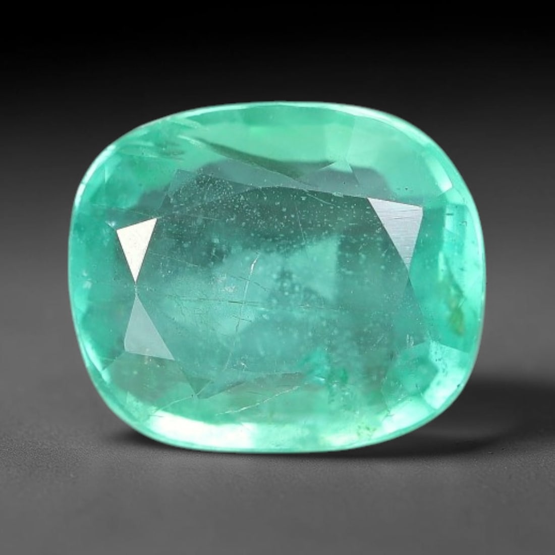 1.05 Carats Natural Zambian Green Emerald Loose Gemstone, 48AH: This green Zambian emerald holds smooth even saturation with subtle faint natural internal markings lending authentic organic character, measured at 7.1x6x3mm, its calm cool green tone delivers unders