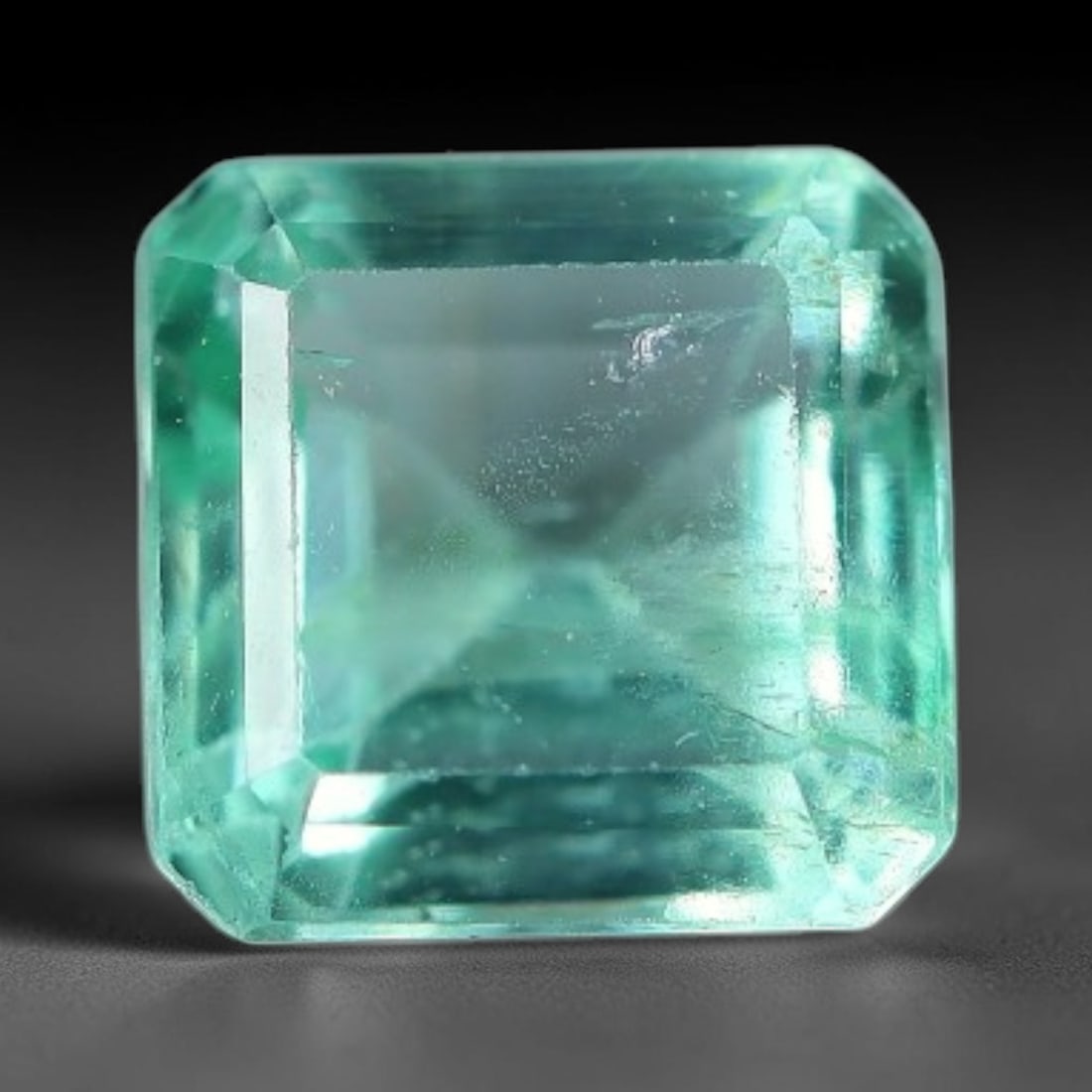 0.81 Carats Natural Zambian Green Emerald Loose Gemstone, 40AH: This green Zambian emerald holds smooth even saturation with subtle faint natural internal markings lending authentic organic character, measured at 5.1x4mm, its calm cool green tone delivers understa
