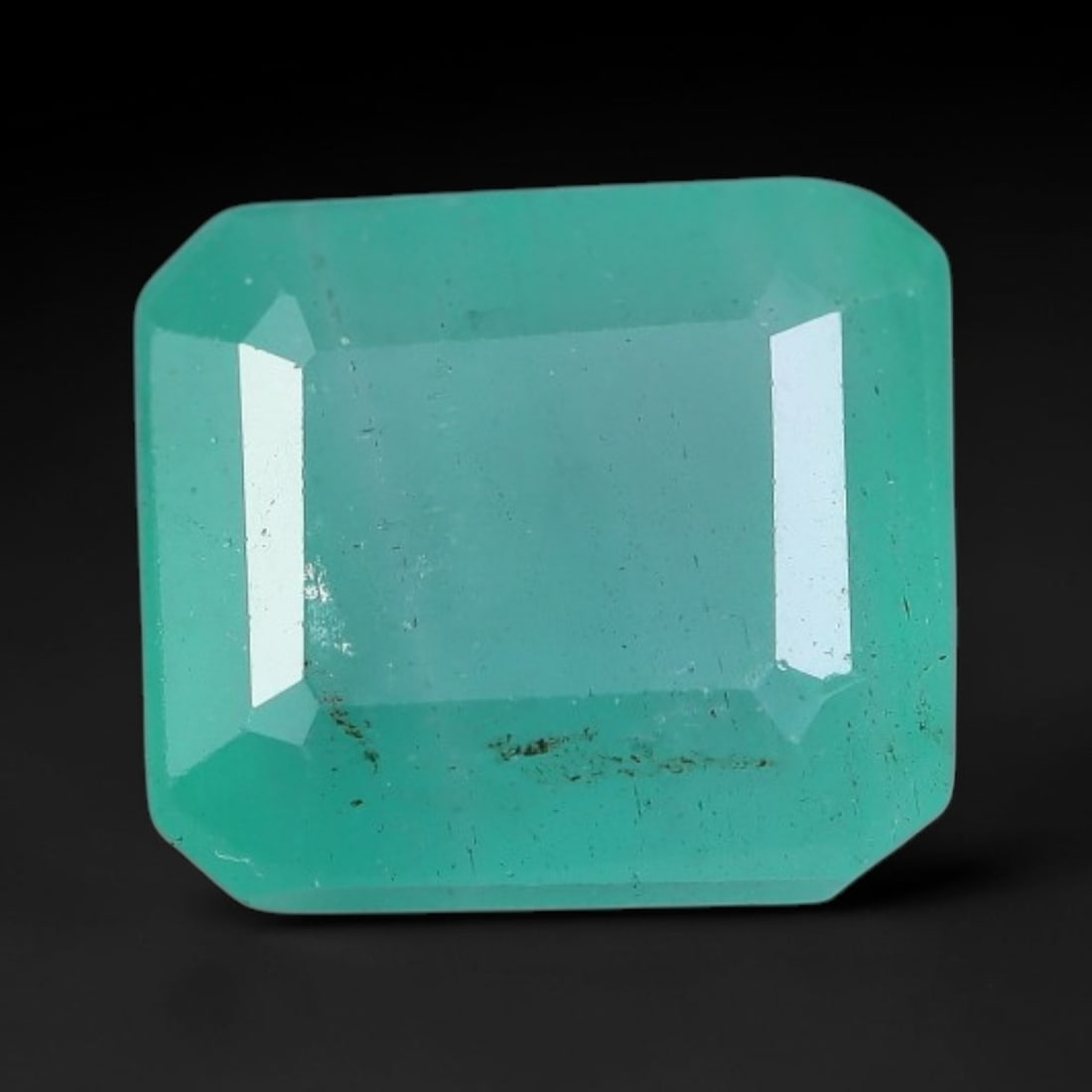 1.90 Carats Natural Zambian Green Emerald Loose Gemstone, 27AH: This green Zambian emerald holds smooth even saturation with subtle faint natural internal markings lending authentic organic character, measured at 7.5x6.7x4.3mm, its calm cool green tone delivers un