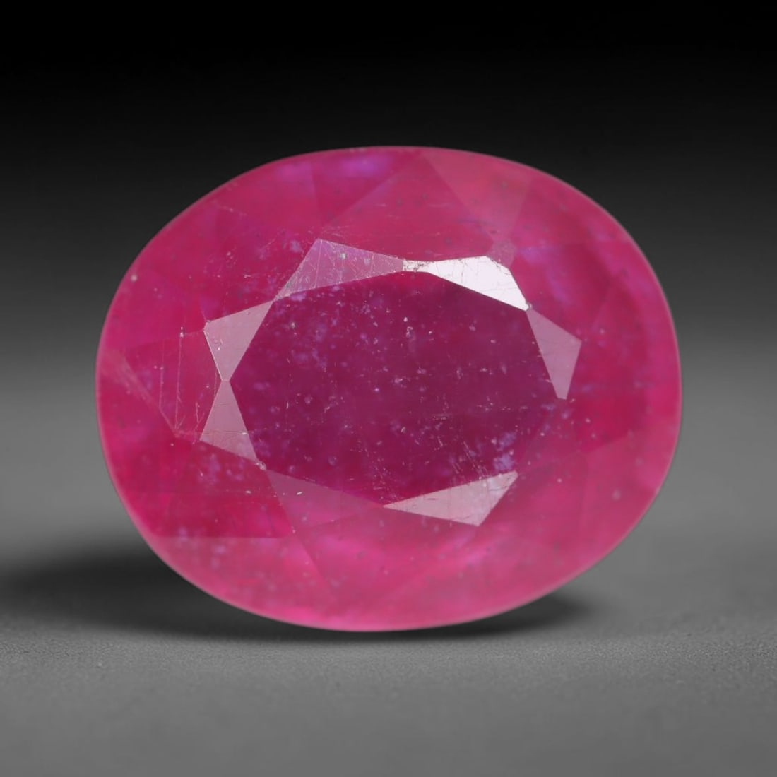 5.11 Carats Natural Madagascar Vivid Magenta Red Ruby Loose Gemstone, 69AH: This vivid magenta-hued Madagascar ruby boasts rich saturated red-pink saturation scattered with tiny fine mineral specks and distinct two-phase fluid bubble inclusions throughout its translucent crys