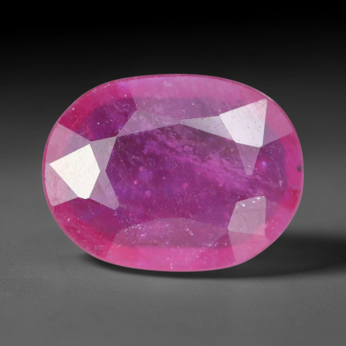 4.35 Carats Natural Madagascar Vivid Magenta Red Ruby Loose Gemstone, 66AH: This vivid magenta-hued Madagascar ruby boasts rich saturated red-pink saturation scattered with tiny fine mineral specks and distinct two-phase fluid bubble inclusions throughout its translucent crys