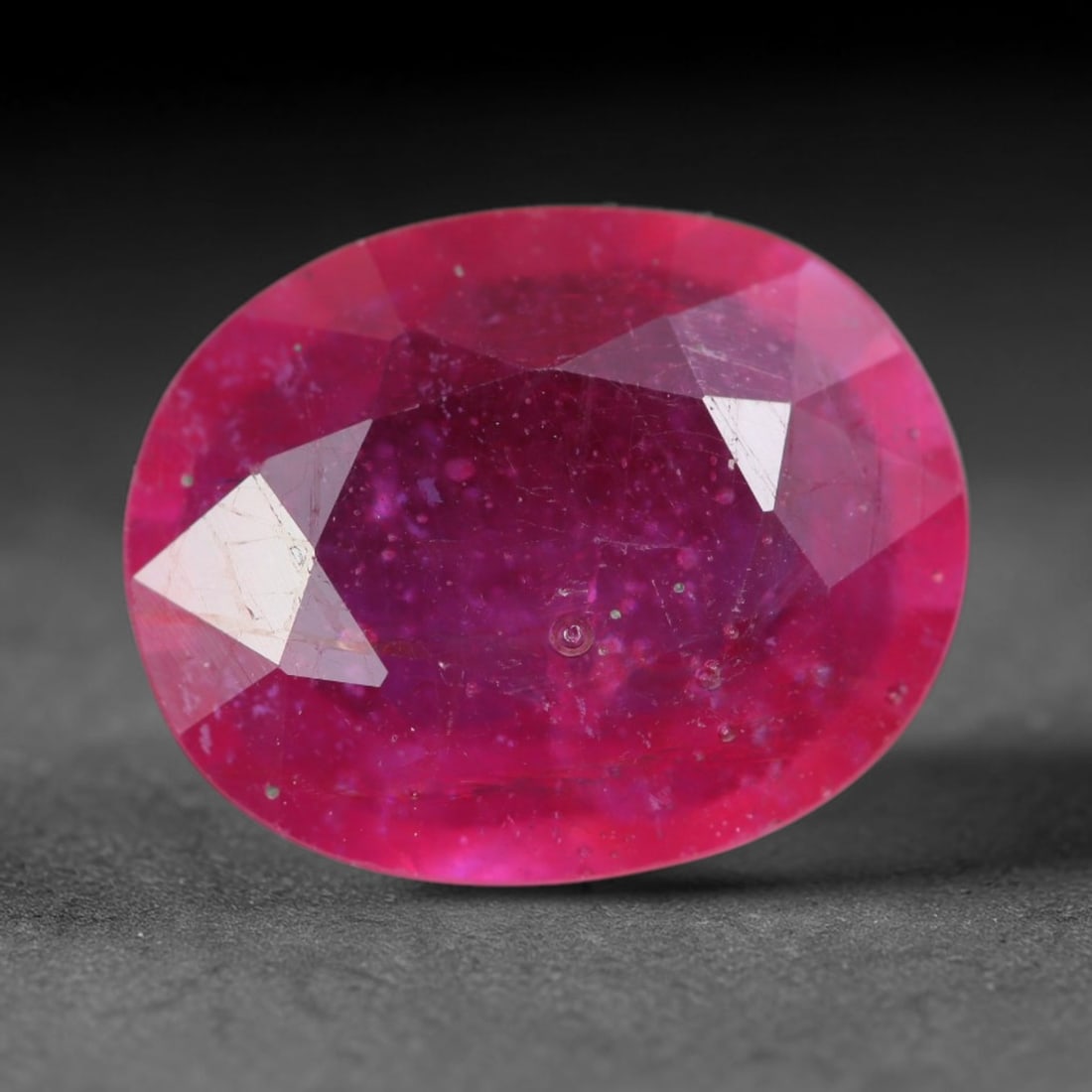 4.98 Carats Natural Madagascar Vivid Magenta Red Ruby Loose Gemstone, 80AH: This vivid magenta-hued Madagascar ruby boasts rich saturated red-pink saturation scattered with tiny fine mineral specks and distinct two-phase fluid bubble inclusions throughout its translucent crys