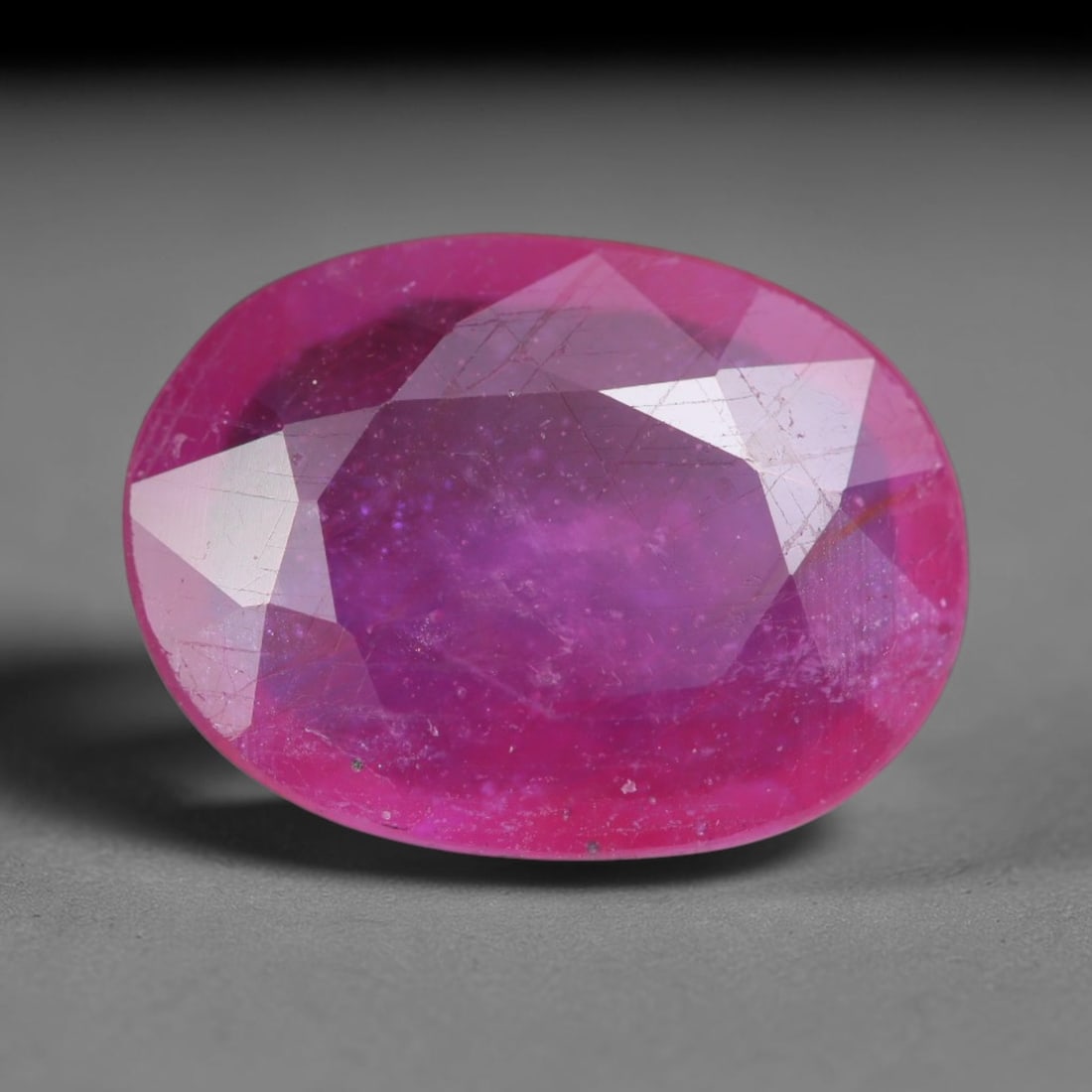 3.93 Carats Natural Madagascar Vivid Magenta Red Ruby Loose Gemstone, 82AH: This vivid magenta-hued Madagascar ruby boasts rich saturated red-pink saturation scattered with tiny fine mineral specks and distinct two-phase fluid bubble inclusions throughout its translucent crys