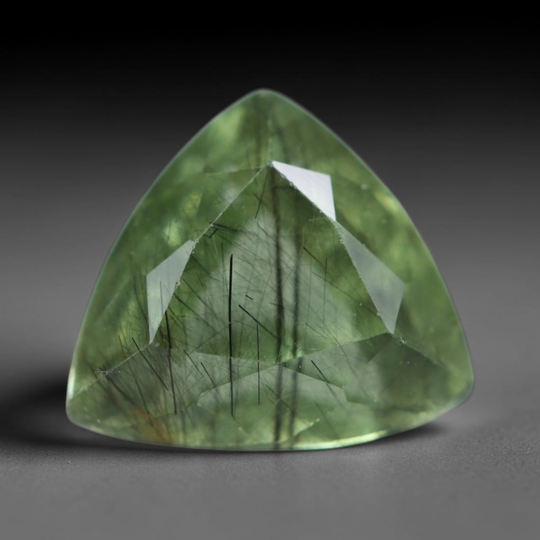 3.08 Carats Natural Pakistani Olive Green Rutilated Peridot Loose Gemstone, 85AH: This translucent peridot displays soft olive green base tone intersected by prominent thin dark needle-like rutile inclusions that create striking linear internal patterns, measured at 9.2x9x6mm. Paki