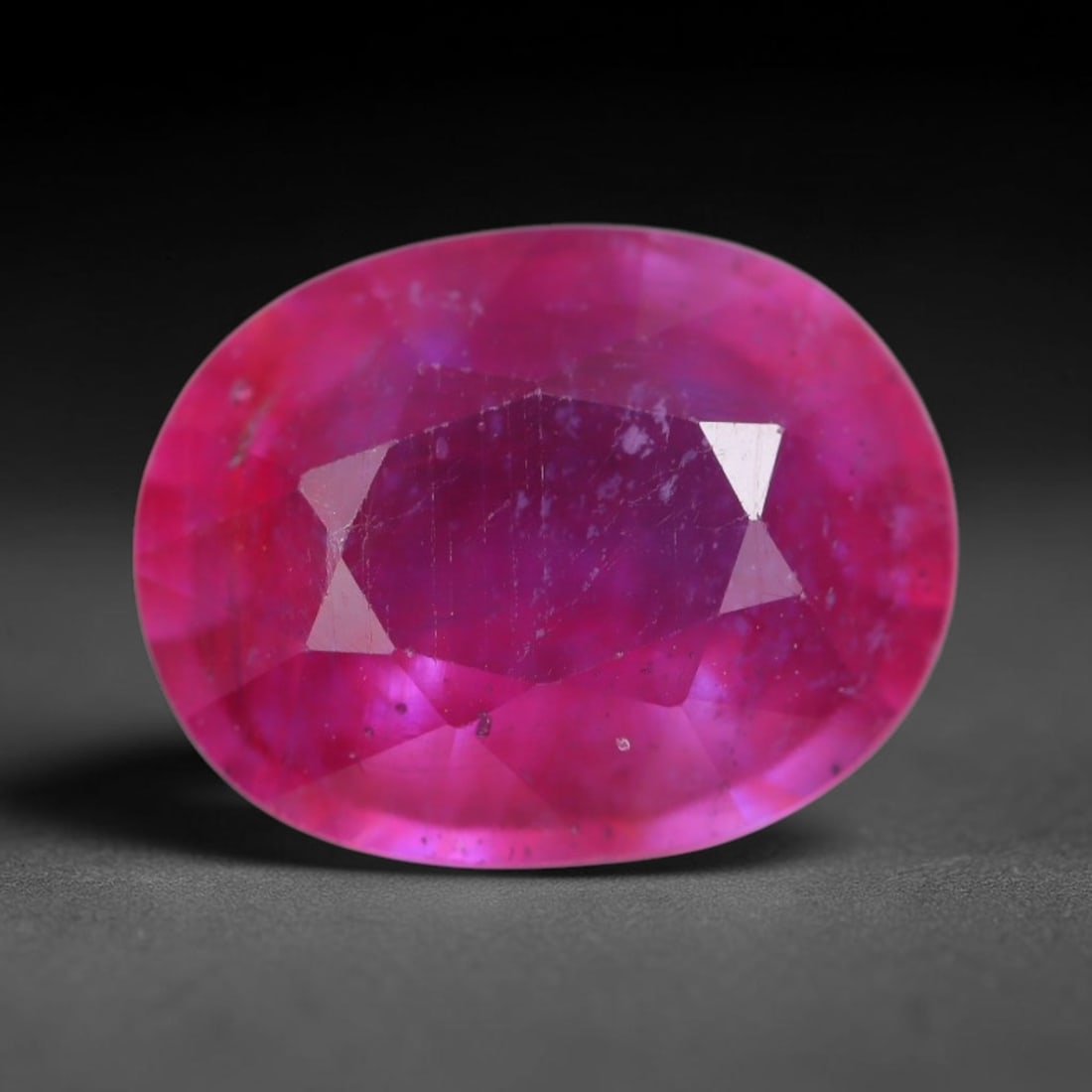 4.56 Carats Natural Madagascar Vivid Magenta Red Ruby Loose Gemstone, 57AH: This vivid magenta-hued Madagascar ruby boasts rich saturated red-pink saturation scattered with tiny fine mineral specks and distinct two-phase fluid bubble inclusions throughout its translucent crys