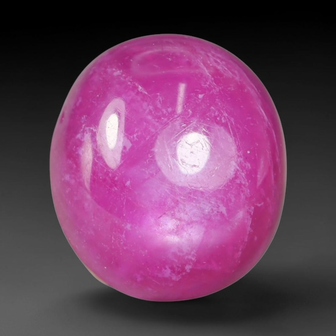 9.12 Carats Natural Madagascar Soft Rose Pink Heated Ruby Cabochon Loose Gemstone, 99AH: This warm blush-toned ruby cabochon carries blended swathes of soft rose pink and gentle peach undertones, with faint natural mineral veining throughout the polished dome, measured at 12x10.4x6.2mm. T