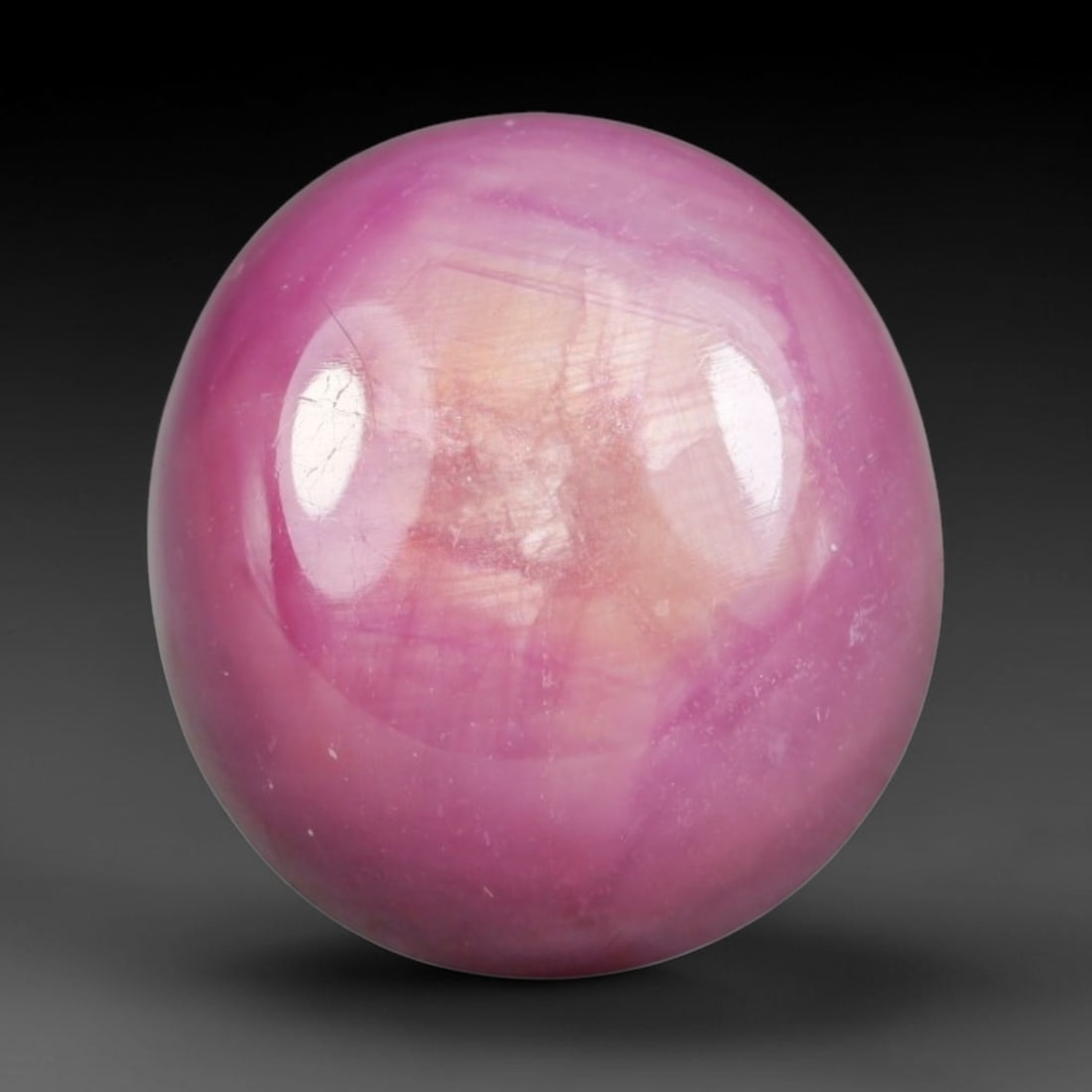 11.86 Carats Natural Madagascar Soft Rose Pink Heated Ruby Cabochon Loose Gemstone, 96AH: This warm blush-toned ruby cabochon carries blended swathes of soft rose pink and gentle peach undertones, with faint natural mineral veining throughout the polished dome, measured at 12.7x11.6x6.8mm.