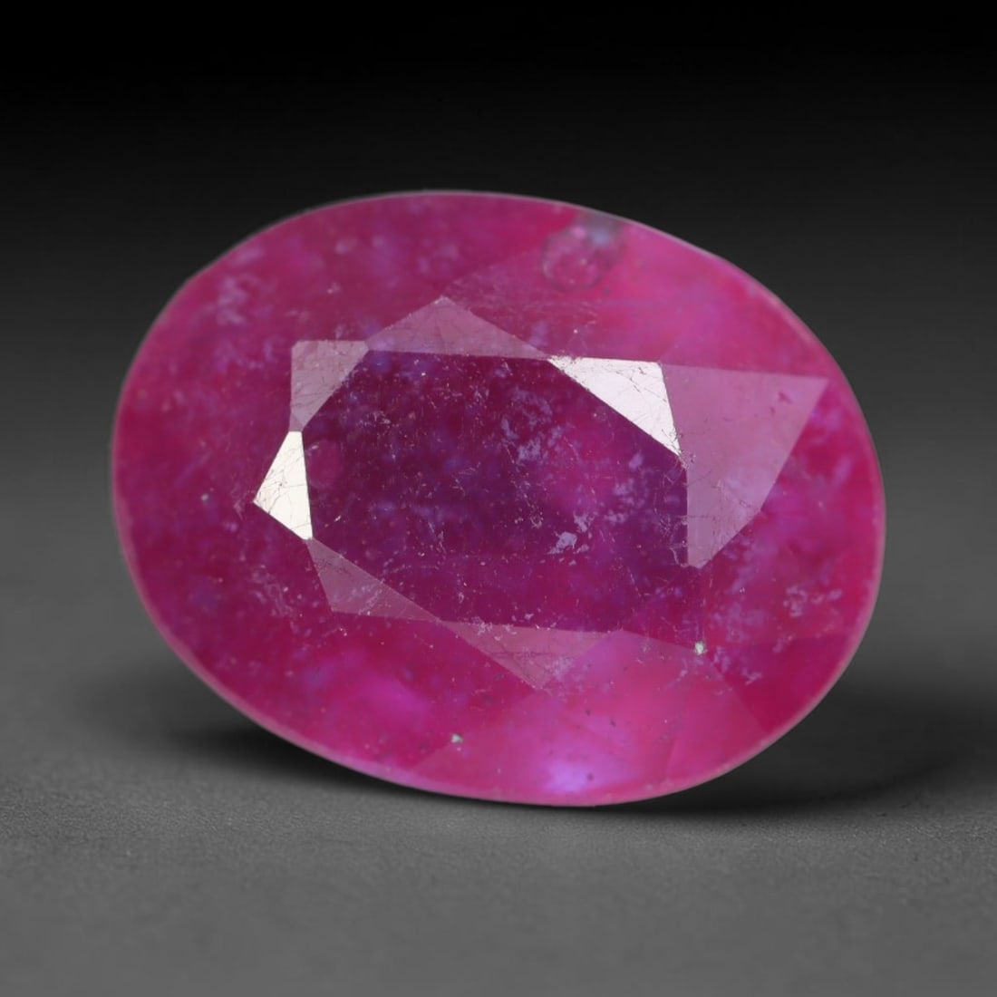 5.34 Carats Natural Madagascar Vivid Magenta Red Ruby Loose Gemstone, 81AH: This vivid magenta-hued Madagascar ruby boasts rich saturated red-pink saturation scattered with tiny fine mineral specks and distinct two-phase fluid bubble inclusions throughout its translucent crys