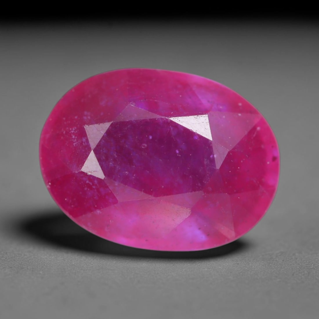 5.81 Carats Natural Madagascar Vivid Magenta Red Ruby Loose Gemstone, 78AH: This vivid magenta-hued Madagascar ruby boasts rich saturated red-pink saturation scattered with tiny fine mineral specks and distinct two-phase fluid bubble inclusions throughout its translucent crys